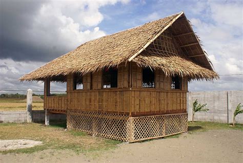 Image of peole living in a typical bahay kubo